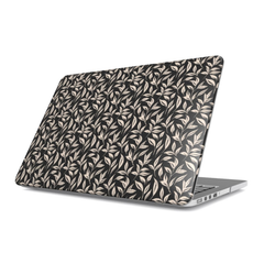 Laptop with a leaf patterned case on a white background