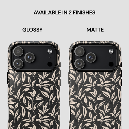 Two phone cases with leaf pattern, one glossy and one matte, on a white background.