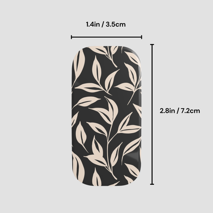 Phone case with leaf pattern and measurements on a gray background