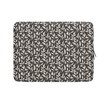 Laptop sleeve with leaf pattern on a white background