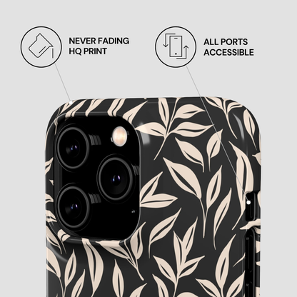 Phone case with leaf pattern on a light gray background