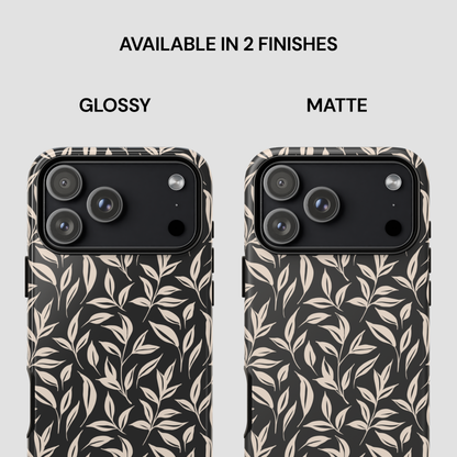 Two phone cases with leaf pattern, one glossy and one matte, on a light gray background.