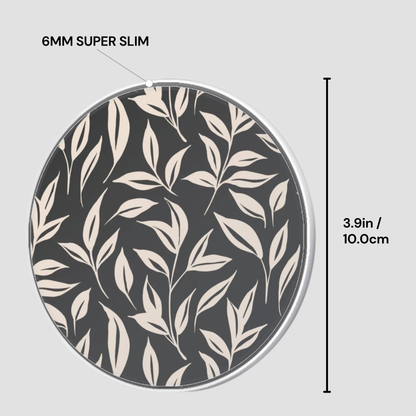 Circular object with leaf pattern and measurement details on a gray background