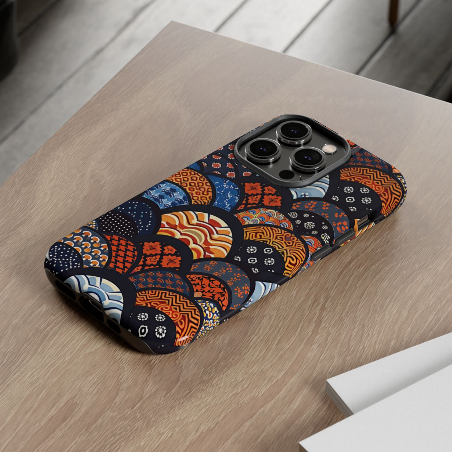 Phone case with a colorful geometric pattern on a wooden surface | Casenari