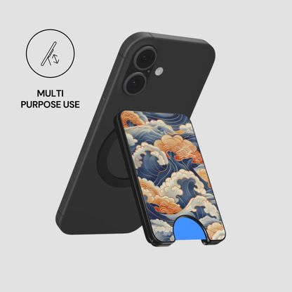 Kumo Nami magnetic wallet attached to a black phone and used as a stand with multi purpose use icon