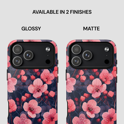 Two phone cases with pink floral design, one glossy and one matte, on a white background.