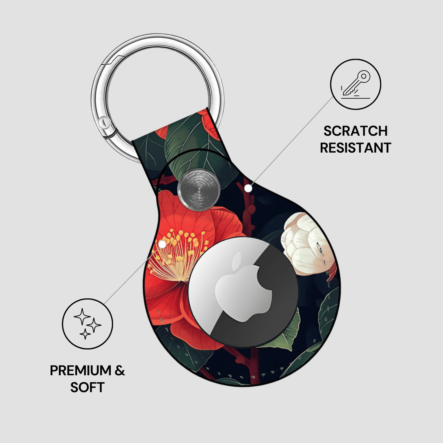 Keychain with floral design and Apple logo on a light gray background