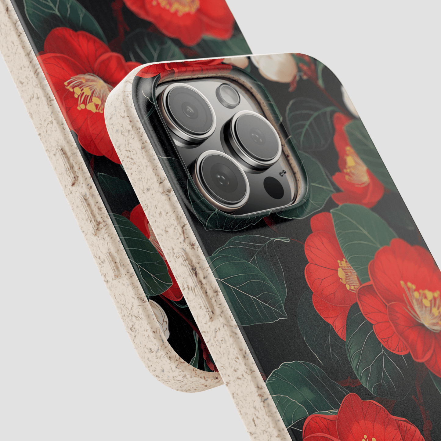 Phone case with red floral design on a black background