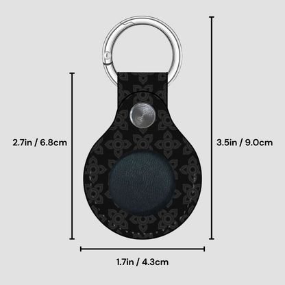 Black keychain with measurements on a gray background