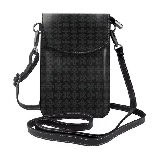 Black patterned crossbody bag on a white background