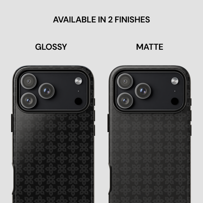 Two black phone cases with different finishes on a gray background