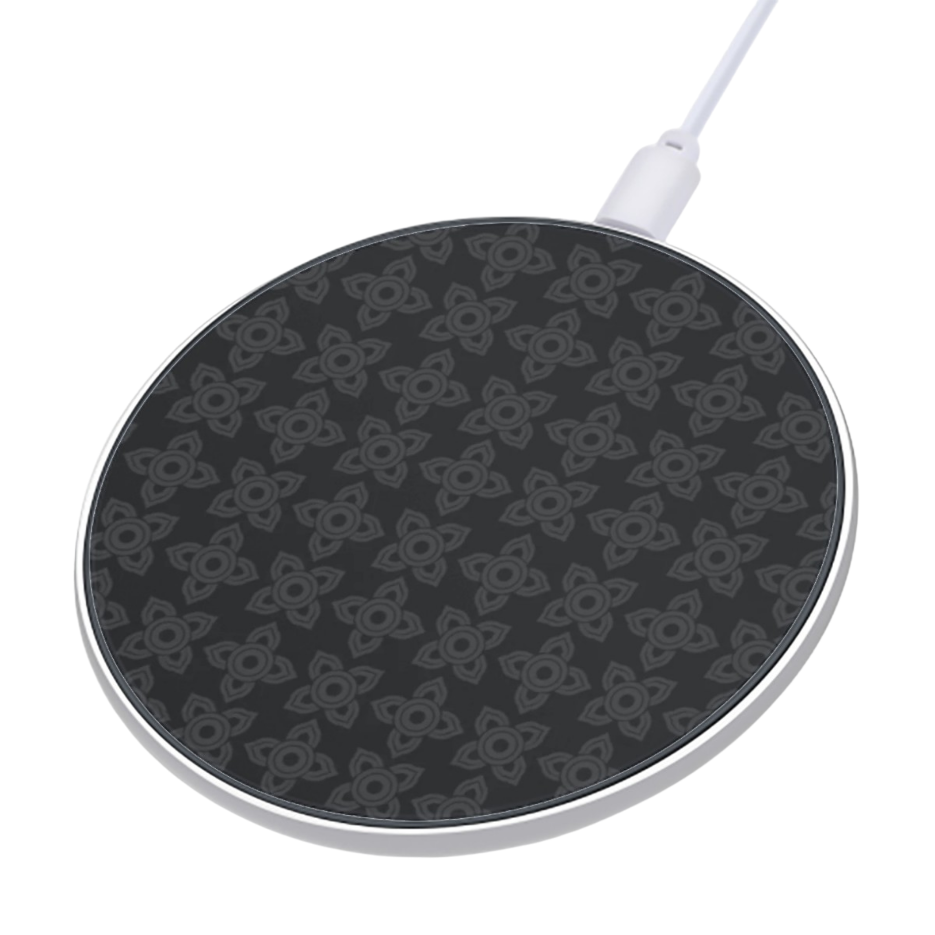 Black wireless charging pad with white cable on a white background