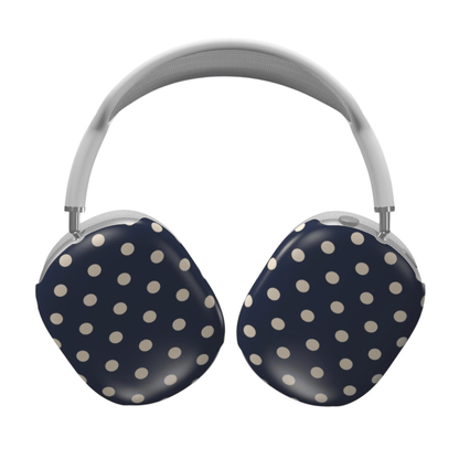 Navy blue headphones with white polka dots on a white background