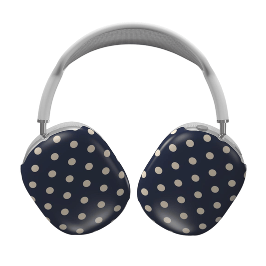 Navy blue headphones with white polka dots on a white background