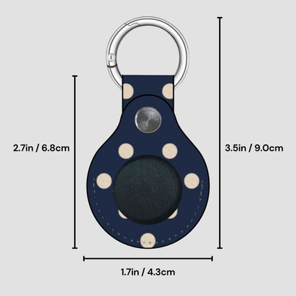 Navy blue keychain with white polka dots and measurements on a gray background