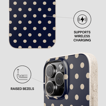 Phone case with polka dot design and wireless charging feature on a light gray background