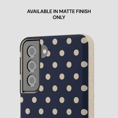 Phone case with polka dot pattern on a light gray background