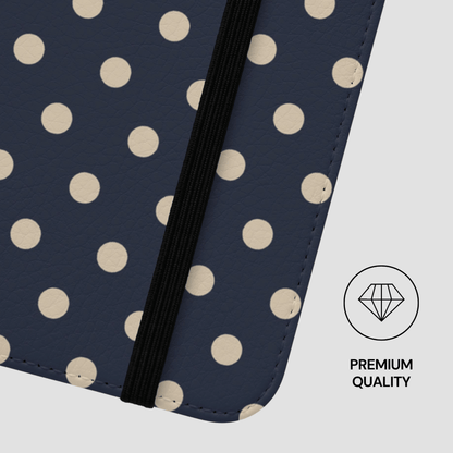 Navy blue case with beige polka dots and a black strap, featuring a 'Premium Quality' label.