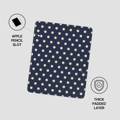 Navy blue case with white polka dots featuring an Apple Pencil slot and thick padded layer on a light gray background.