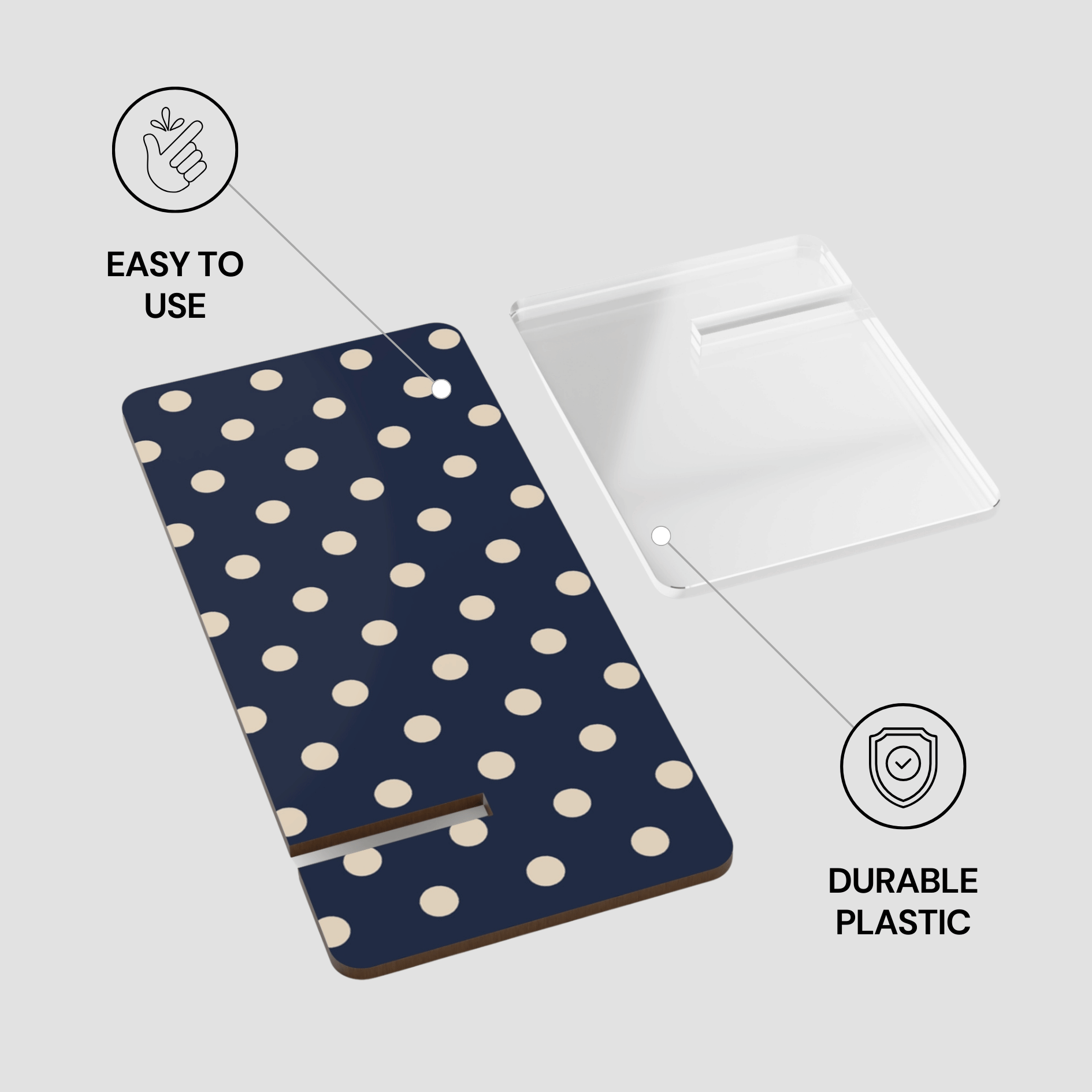 Navy blue phone case with white polka dots on a gray background