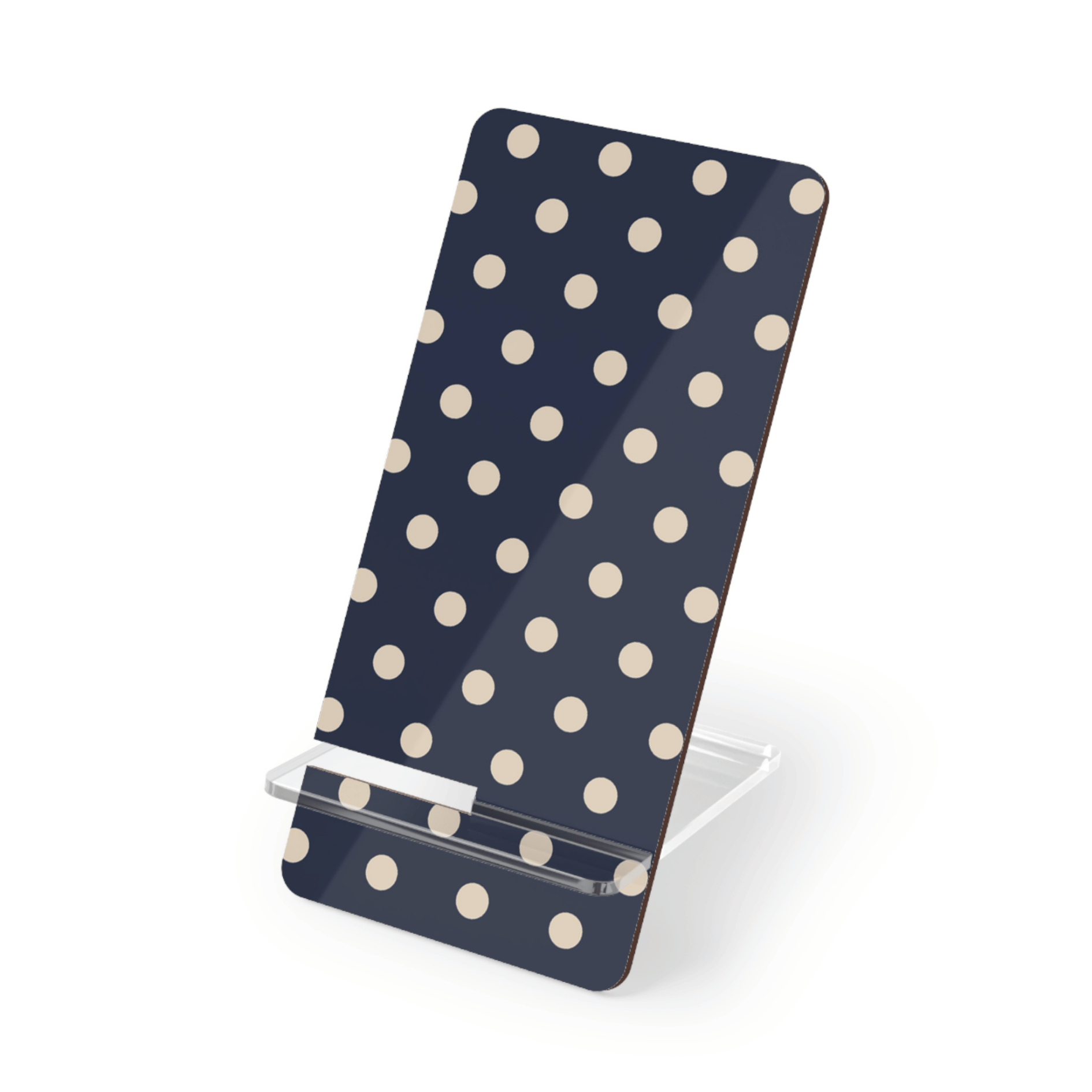 Phone stand with polka dot design on a white background