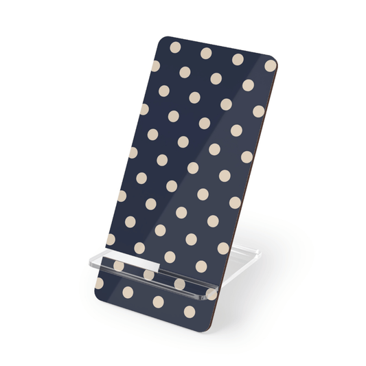 Phone stand with polka dot design on a white background