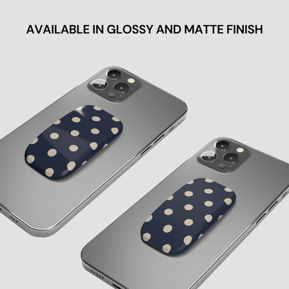 Two phone cases with polka dot design on a gray background