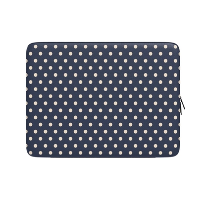Navy blue laptop sleeve with white polka dots on a white background