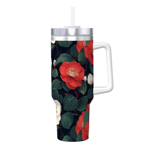 Tumbler with floral design featuring red flowers and green leaves on a white background