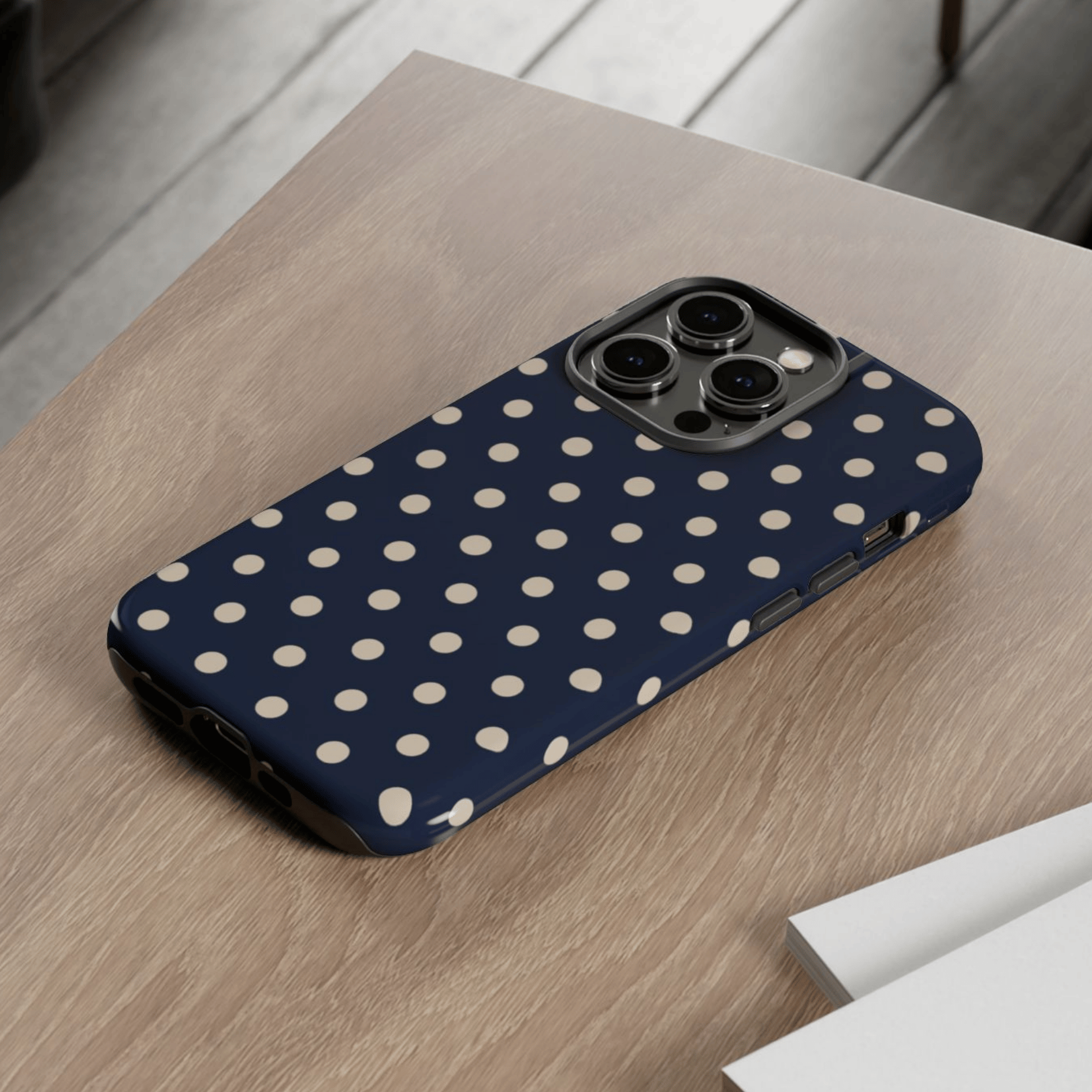 Phone case with polka dot pattern on a wooden surface