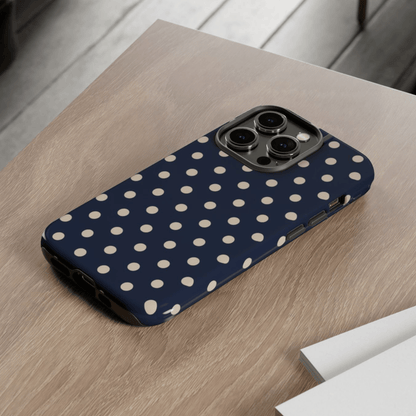 Phone case with polka dot pattern on a wooden surface