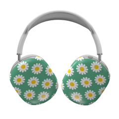 Headphones with daisy pattern on a green background