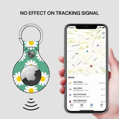 Green floral tracker with a keychain and a phone displaying a location app.