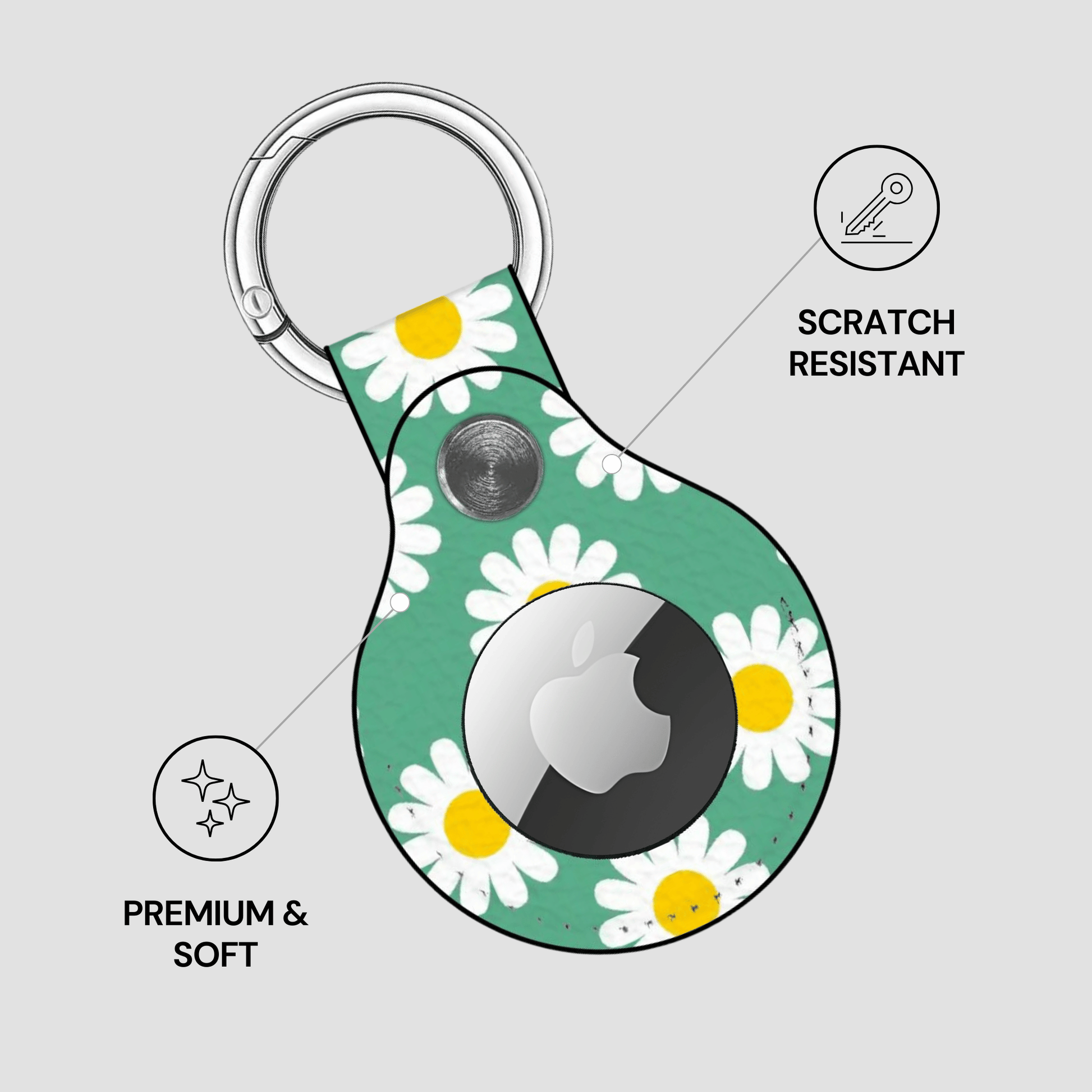 Keychain with daisy pattern and Apple logo on a gray background