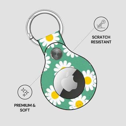 Keychain with daisy pattern and Apple logo on a gray background