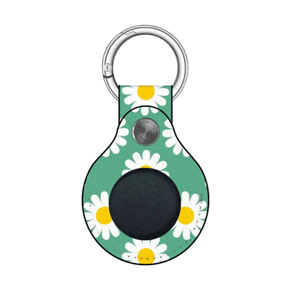 Keychain with daisy pattern on a green background