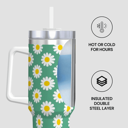 Tumbler with daisy pattern on a green background, featuring text about insulation and temperature retention.