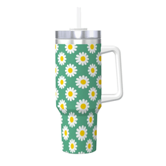 Tumbler with daisy pattern on a green background