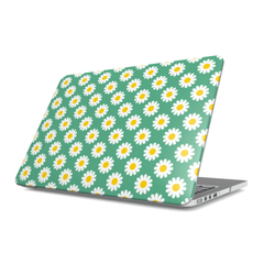 Laptop with a daisy pattern on a green background