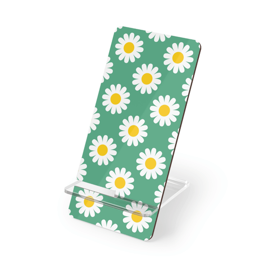Phone stand with daisy pattern on a green background