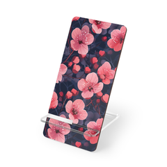 Phone stand with pink floral design on a white background