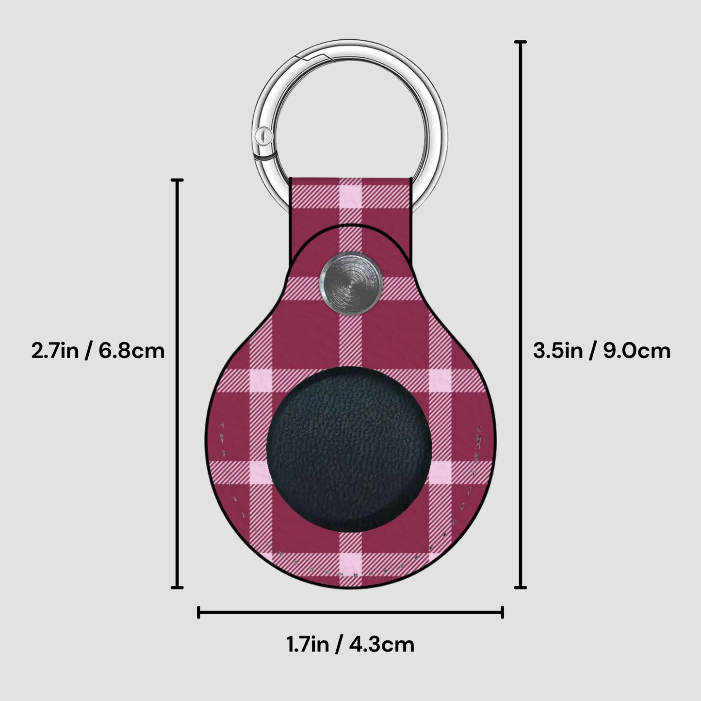 Plaid patterned keychain with measurements on a gray background