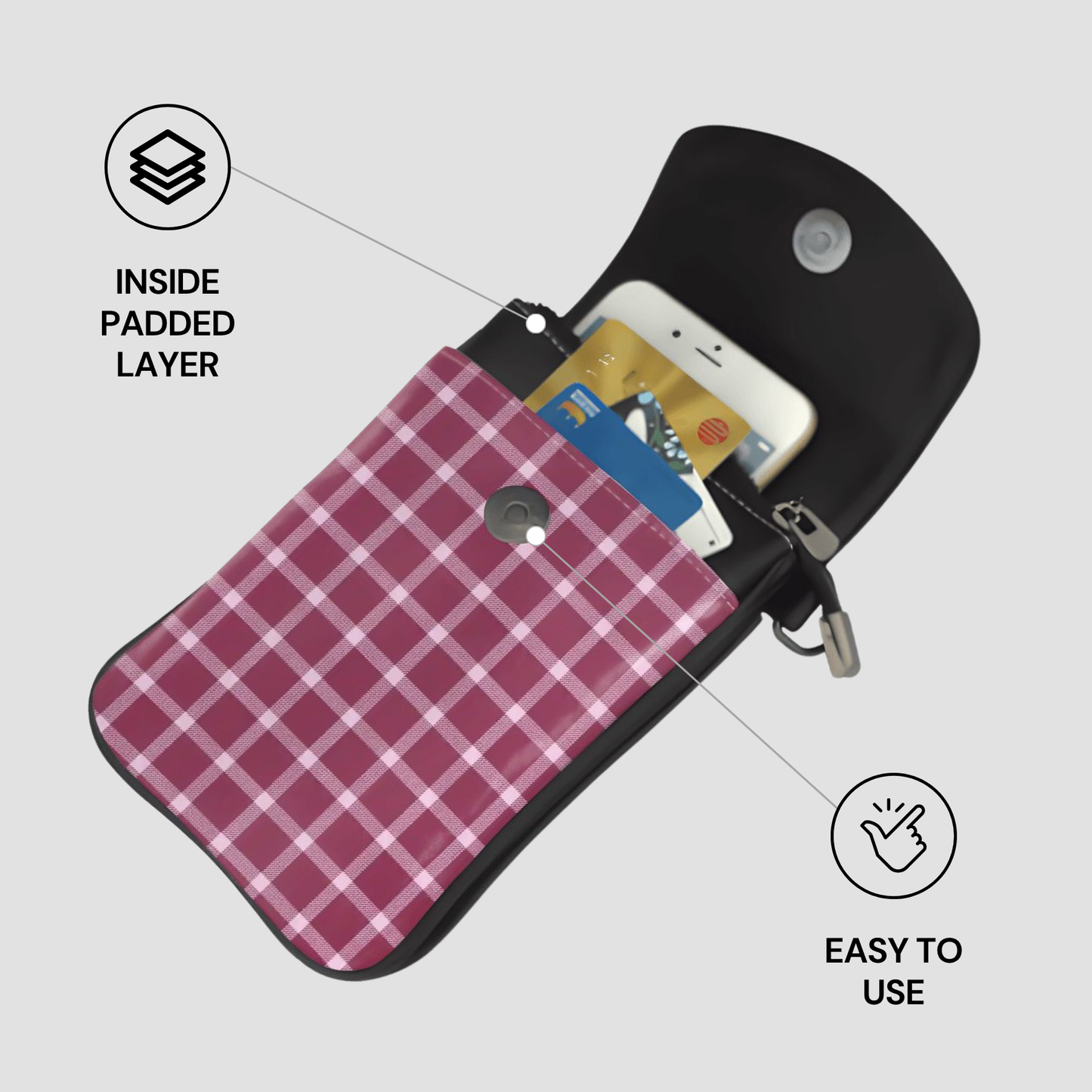 Black pouch with pink plaid interior holding a phone and cards, on a light gray background.