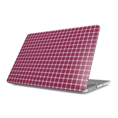 Laptop with a red and white checkered case on a white background