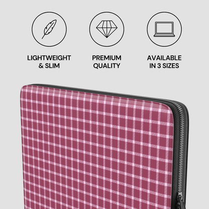 Plaid patterned laptop sleeve with features listed on a light gray background