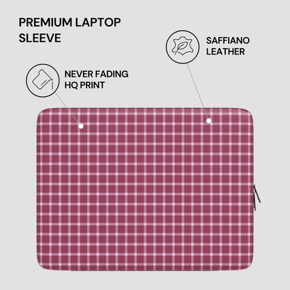 Plaid laptop sleeve with saffiano leather finish on a light gray background