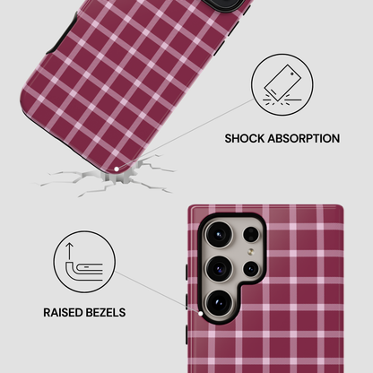 Pink plaid phone case with shock absorption and raised bezels features on a white background