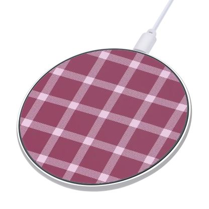 Wireless charging pad with pink plaid pattern on a white background