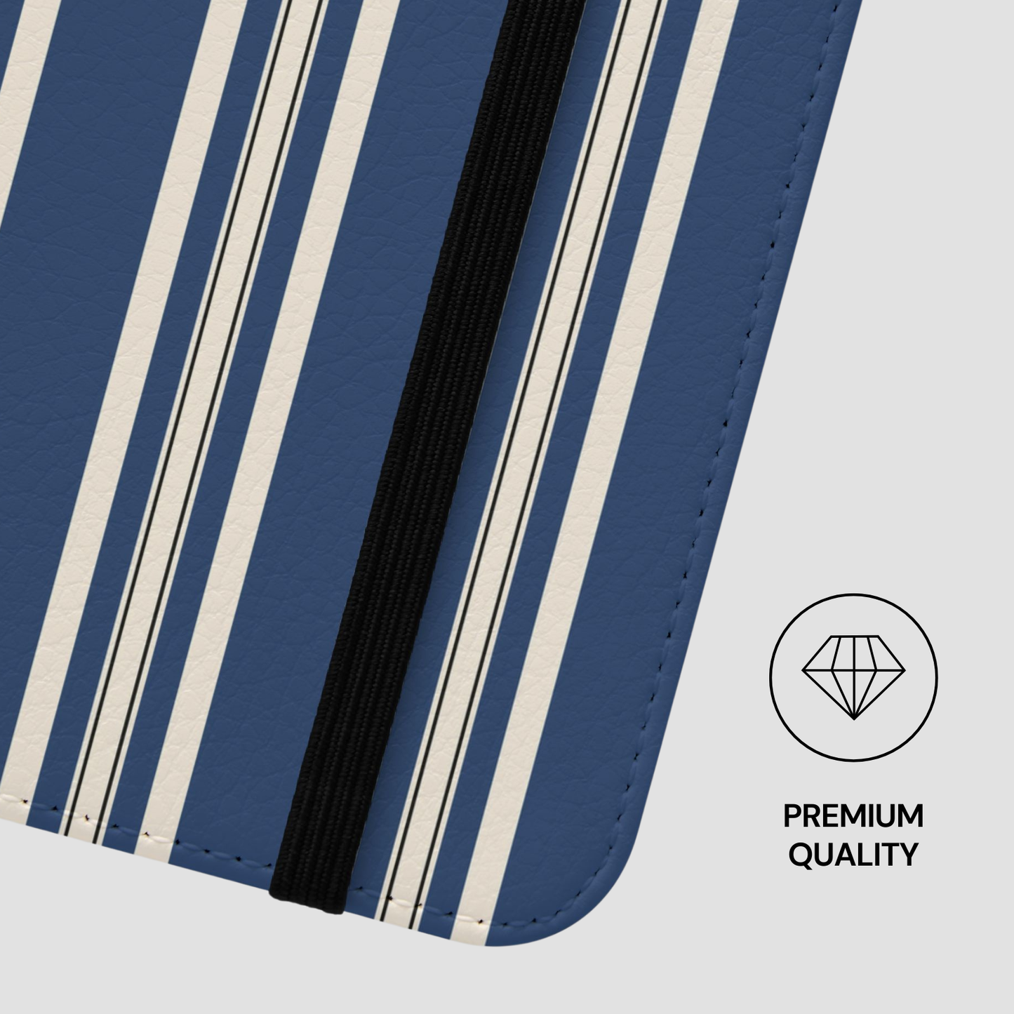 Close-up of a blue and white striped product with a black strip, on a light gray background.