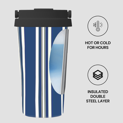 Blue striped insulated tumbler with black lid on a light gray background